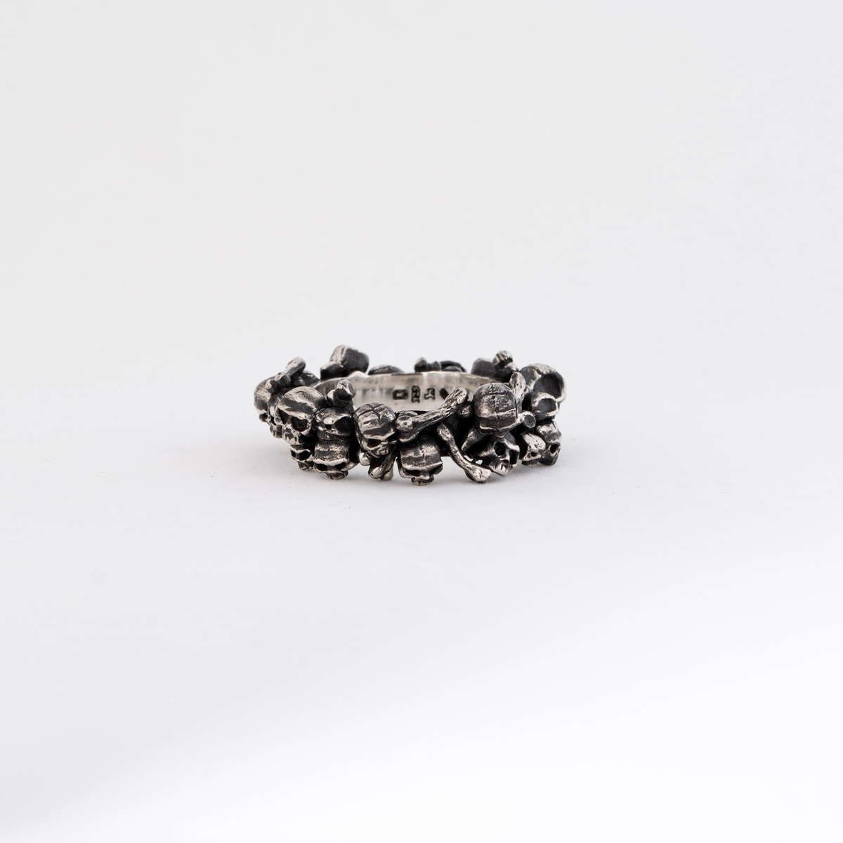 a ring surrounded by skulls